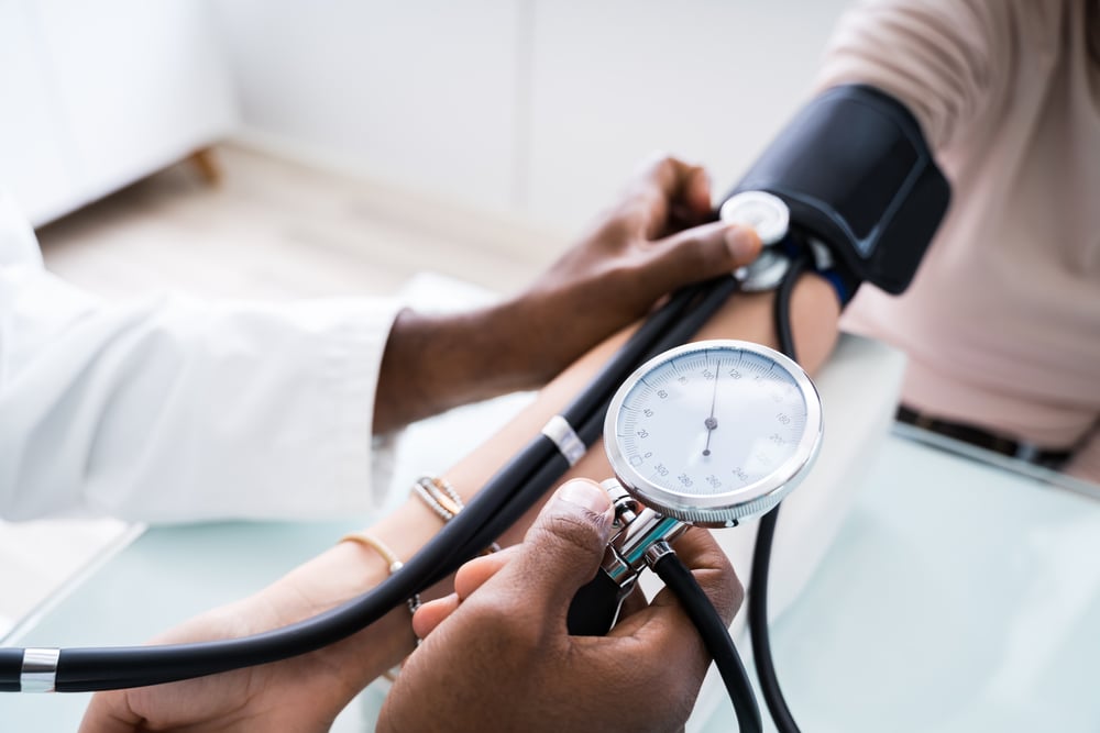 Close Up,of,doctor,measuring,patients,blood,pressure,with,stethoscope