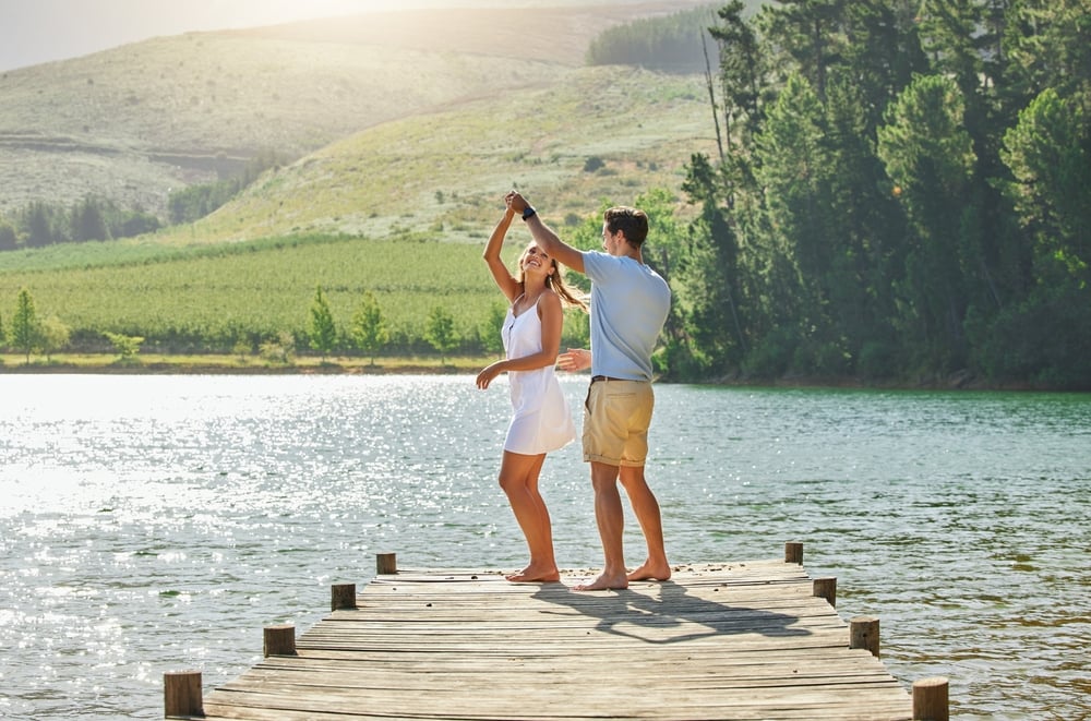 Lake,,dancing,and,happy,nature,couple,on,outdoor,quality,time